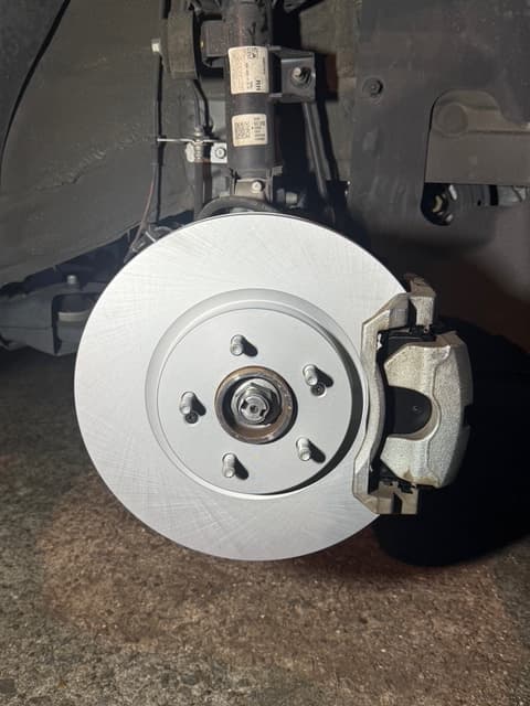 Fresh brake rotor and caliper install